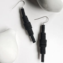 Load image into Gallery viewer, Revamp your classic dangle earrings with a modern minimalist twist. Our one-of-a-kind design features stacked sequins that create a bold yet muted impact. Enjoy the supreme softness and lightweight feel of these earrings as you move freely in their swing. The lengthening effect adds dimension and flatters your face. Don't miss out on this unique statement piece. Shop now for a pair of earrings that combine elegance with contemporary design.