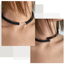 Load image into Gallery viewer, Hand-stitched with smooth leather tube on one side and textured leather sequins on the other. Featuring a vitreous lustre, clear quartz helps to declutter the mind, body, and spirit to create clarity and focus around a desire, allowing you to amplify your inner power and live, laugh, and love to your fullest potential. Made by WAIWAI, this choker is the softest, lightest, and most comfortable you will ever wear, with absolutely no resistance against your neck.