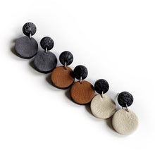 Load image into Gallery viewer, Effortlessly chic minimalist earrings in earthy tones. Basic shapes & delicate leather grain add subtle character. Suspended circles symbolize wholeness & promote a state of calm. Perfect for modernizing any outfit.