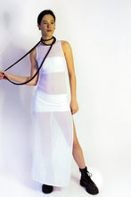 Load image into Gallery viewer, Elevate your style with our bold and modern extra-long necklace. Crafted with genuine leather disks ranging from 6-14mm and cotton waxed cord, it's a true statement piece that challenges the ideals of traditional accessories. Wear it as is or get creative by draping it around your waist or creating a crossed pattern. This disruptor of a necklace is sure to turn heads and start conversations. Shop now for a minimalistic yet eye-catching addition to your high-fashion wardrobe.