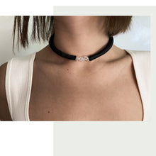 Load image into Gallery viewer, Hand-stitched with smooth leather tube on one side and textured leather sequins on the other. Featuring a vitreous lustre, clear quartz helps to declutter the mind, body, and spirit to create clarity and focus around a desire, allowing you to amplify your inner power and live, laugh, and love to your fullest potential. Made by WAIWAI, this choker is the softest, lightest, and most comfortable you will ever wear, with absolutely no resistance against your neck.