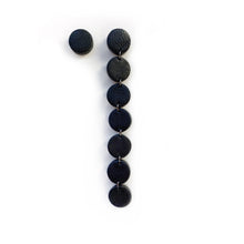 Load image into Gallery viewer, Elevate your style with a modern, asymmetric long mono earring. Lightweight and luxuriously soft, this flowy earring adds sophistication to any look, from elegant to casual. Embrace the beauty of imperfection and asymmetry for a confident, carefree expression. Comes with a single leather stud for a simple yet captivating design.