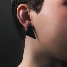 Load image into Gallery viewer, Our leather triangle earrings represent balance and power. The opulent leather adds a bold touch to your outfit. Wear them for a magical boost. Shop now and embrace sharp angles.