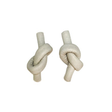 Load image into Gallery viewer, Handcrafted Leather knot stud earrings - a symbol of eternal connection and cherished bond. These earrings offer the perfect amount of visual interest for a flattering and pronounced presence, adding simple sophistication whether you're dressed up or down. The luxurious feel and suppleness of the fine leather is something to be admired, and the subtle colour-matched stitching reveals impeccable hand craftsmanship. Feel anchored with the knot and enjoy the timeless elegance of these earrings.