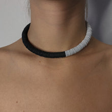 Load image into Gallery viewer, Made from individually punched genuine leather sequins and stainless steel memory wire, this choker is the softest, lightest, and most comfortable choker you will ever wear. It flexes easily to put on and adjusts to neck size, with absolutely no resistance against your neck, allowing you to forget its presence. With no clasp, this choker can be worn with the opening at the front.