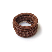 Load image into Gallery viewer, Make a statement with this helical leather cuff bracelet. Its bold simplicity and high texture are inspired by the natural world and the resilience it embodies. Crafted from individually punched genuine leather sequins, this cuff is soft, lightweight, and comfortable for all-day wear. The stainless steel memory wire allows for easy adjustment to fit any wrist size. Add a touch of nature-inspired elegance to your everyday look.