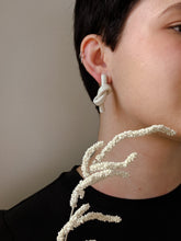 Load image into Gallery viewer, Handcrafted Leather knot stud earrings - a symbol of eternal connection and cherished bond. These earrings offer the perfect amount of visual interest for a flattering and pronounced presence, adding simple sophistication whether you're dressed up or down. The luxurious feel and suppleness of the fine leather is something to be admired, and the subtle colour-matched stitching reveals impeccable hand craftsmanship. Feel anchored with the knot and enjoy the timeless elegance of these earrings.