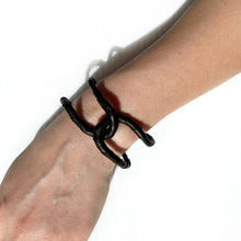 Load image into Gallery viewer, Anchor your style with the black leather bracelet. The wrapped leather adds texture and interest while the creative construction allows you to reshape the flexible links to your liking. The perfect addition to any outfit.