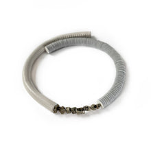 Load image into Gallery viewer, Our hand-stitched white leather choker with pyrite crystals embodies empowerment anchored by serenity. Pyrite deflects negative energy and promotes physical healing and mental strength. Complement any outfit with this choker that is soft, comfortable, and easy to wear. Shop now and feel empowered both inside and out.