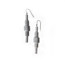 Load image into Gallery viewer, Revamp your classic dangle earrings with a modern minimalist twist. Our one-of-a-kind design features stacked sequins that create a bold yet muted impact. Enjoy the supreme softness and lightweight feel of these earrings as you move freely in their swing. The lengthening effect adds dimension and flatters your face. Don't miss out on this unique statement piece. Shop now for a pair of earrings that combine elegance with contemporary design.