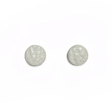 Load image into Gallery viewer, Uncomplicated and effortless, our leather stud earrings are a modern classic. Texture, softness, and sophistication in a tiny package. Appreciate the small things and enhance any outfit. Shop now and elevate your style with simplicity.