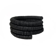 Load image into Gallery viewer, a bracelet made of genuine leather sequins. The bracelet has a helical design that represents evolution, growth, and resilience, echoing the natural world and human cells. It is a statement piece that channels strength and stability. The bracelet is soft, lightweight, and comfortable to wear all day. It can be adjusted to fit your wrist size or stretched out to your desired length.