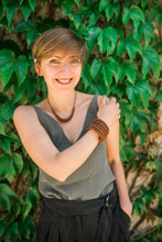 Load image into Gallery viewer, Make a statement with this helical leather cuff bracelet. Its bold simplicity and high texture are inspired by the natural world and the resilience it embodies. Crafted from individually punched genuine leather sequins, this cuff is soft, lightweight, and comfortable for all-day wear. The stainless steel memory wire allows for easy adjustment to fit any wrist size. Add a touch of nature-inspired elegance to your everyday look.