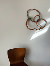 Load image into Gallery viewer, Decorative wall piece with natural elements on a plain wall
