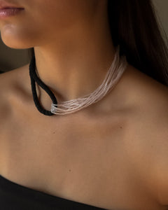 Model wearing black leather and clear glass bead choker, sculptural interlocking necklace by WAIWAI