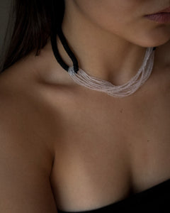 Model wearing black leather and clear glass bead choker, sculptural interlocking necklace by WAIWAI