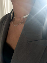 Load image into Gallery viewer, Close-up of a handcrafted leather choker featuring smooth black leather and delicate silver Japanese glass beads, creating a bold yet elegant minimalist design