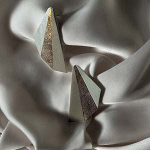 Handcrafted modern leather statement earrings in light hues, including a dazzling gold, inspired by butterfly wings