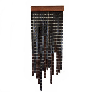 Modern home decor accent piece crafted from rich brown leather, supple suede, and stained poplar wood, adding luxury to any space.