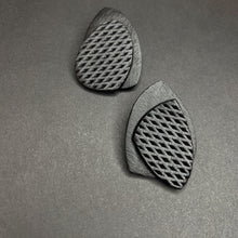 Load image into Gallery viewer, Striking black leather earrings with unique organic shapes, handcrafted from premium upcycled leather. Each pair combines smooth and textured surfaces for a visually contrasting design, ideal for adding a chic, eco-conscious touch to any outfit.