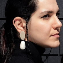 Load image into Gallery viewer, Leather earrings adorned with mesmerizing white jade stones that evoke tranquility and purity. The white jade is known for its calming properties and spiritual significance, adding timeless elegance to the design