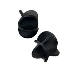 Load image into Gallery viewer, Close-up of Rivelis Earrings, featuring a unique, multi-dimensional design crafted from black, supple leather. The earrings have a nature-inspired, fluid shape that is both lightweight and elegant.