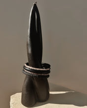 Load image into Gallery viewer, Black leather coil bracelet made from punched disks and stitched leather tube, with blush pink shiny glass beads
