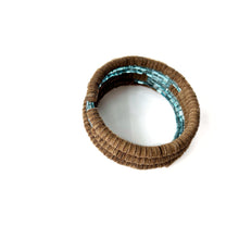 Load image into Gallery viewer, Wrap-around bracelet featuring earthy suede leather and shimmering Japanese beads in a layered design, showcasing a blend of texture and elegance. Lightweight and adjustable for a comfortable fit.