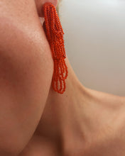 Load image into Gallery viewer, Cascading red beaded earrings with hand‑stitched strands on a leather base, handmade by WAIWAI.