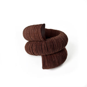 Handcrafted bracelet made from upcycled leather in a rich brown tone, featuring a sculptural and layered design with a unique spiral form.