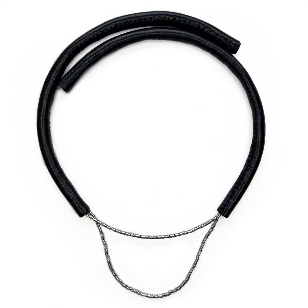 Close-up of a handcrafted leather choker featuring smooth black leather and delicate silver Japanese glass beads, creating a bold yet elegant minimalist design