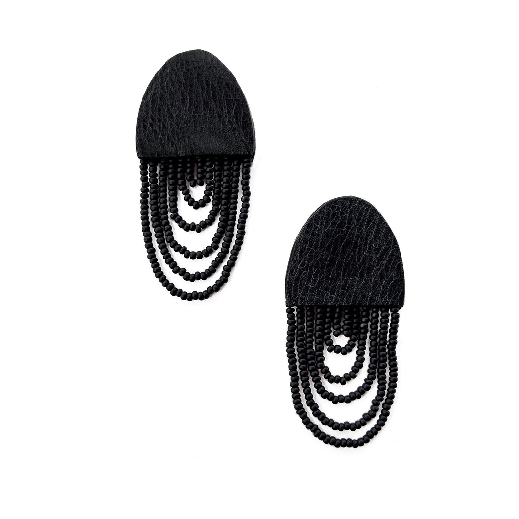 Black leather earrings with cascading shiny bead layers, featuring a textured finish and lightweight, modern design.