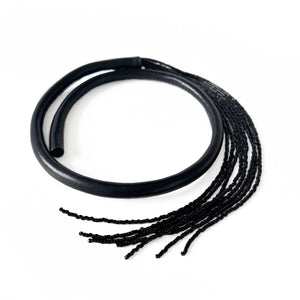 Black leather choker with black beaded tassel, showcasing a versatile design that can be worn in multiple ways.