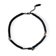 Load image into Gallery viewer, Handcrafted necklace featuring black leather discs, glossy obsidian stones, and translucent smoky quartz gemstones, designed with a bold and modern aesthetic.