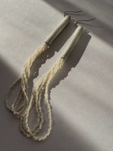Load image into Gallery viewer, Pair of beige thread earrings on a light gray background