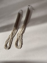 Load image into Gallery viewer, Pair of beige earrings on a light gray background