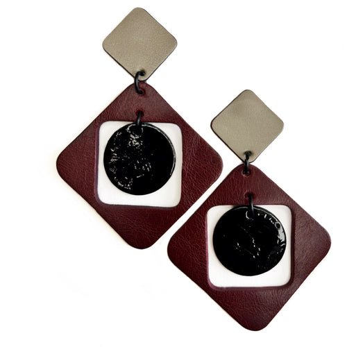 Geometric burgundy and beige leather earring with black lacquer circle, handcrafted statement jewelry