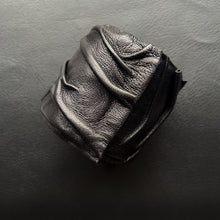 Load image into Gallery viewer, A handcrafted Ripple Leather Cuff featuring a wide, wave-inspired design made from soft, genuine leather. The cuff wraps comfortably around the wrist, showcasing its unique texture and bold style.