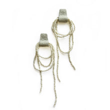Load image into Gallery viewer, Off-white earrings with layered seed bead loops and upcycled leather base in a matching tone on white background.
