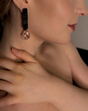Load image into Gallery viewer, Model wearing long leather earrings with clear quartz, lightweight minimalist statement earrings