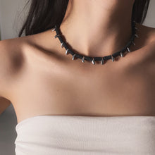 Load image into Gallery viewer, Necklace with spikes worn by a person against a neutral background