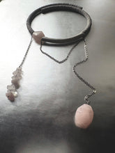 Load image into Gallery viewer, Necklace with pink rose quartz stones on a reflective surface