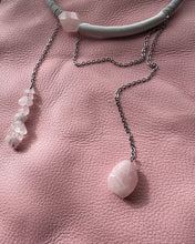 Load image into Gallery viewer, Necklace with pink rose quartz stones on a pink textured surface