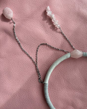 Load image into Gallery viewer, Necklace with pink beads on a pink textured surface
