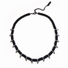 Load image into Gallery viewer, Black leather necklace with spike-like beads on a white background