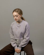 Load image into Gallery viewer, Woman wearing a light gray sweater sitting on a chair against a plain background wearing white leather choker with rose quartz stones
