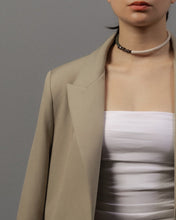 Load image into Gallery viewer, Model wearing minimal structured leather choker in off white and green with natural stone detail 