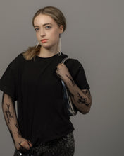 Load image into Gallery viewer, Long sculptural earrings handcrafted from reclaimed leather with strands of transparent silver-lined Japanese glass beads and stainless steel posts.