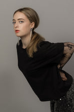 Load image into Gallery viewer, Long sculptural earrings handcrafted from reclaimed leather with strands of transparent silver-lined Japanese glass beads and stainless steel posts.