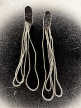 Load image into Gallery viewer, Long sculptural earrings handcrafted from reclaimed leather with strands of transparent silver-lined Japanese glass beads and stainless steel posts.